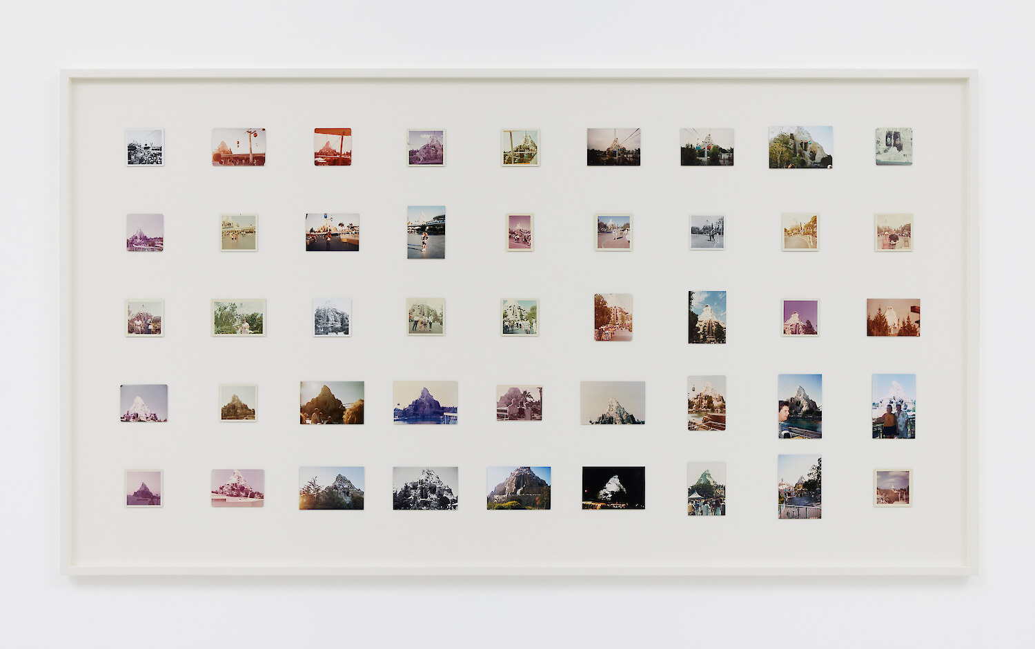 *Ages (Paleocene)*, 2022, 45 found photos dating from 1964–2012, 118 x 214.5 x 5 cm
