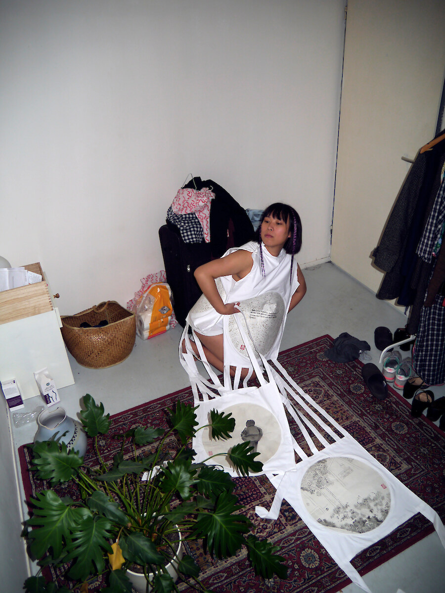 Evelyn Taocheng Wang, *Posing for Banner of Tunnel Security Woman, No. 2,* 2019, Digital C-Print, 42 x 31.5 cm