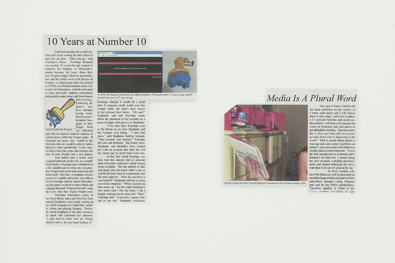 Detail View, *Media Is A Plural Word*, 2018, inkjet on newsprint, McDonald's Happy Meal toys, MDF board, 41.5 x 55 x 2.5 cm