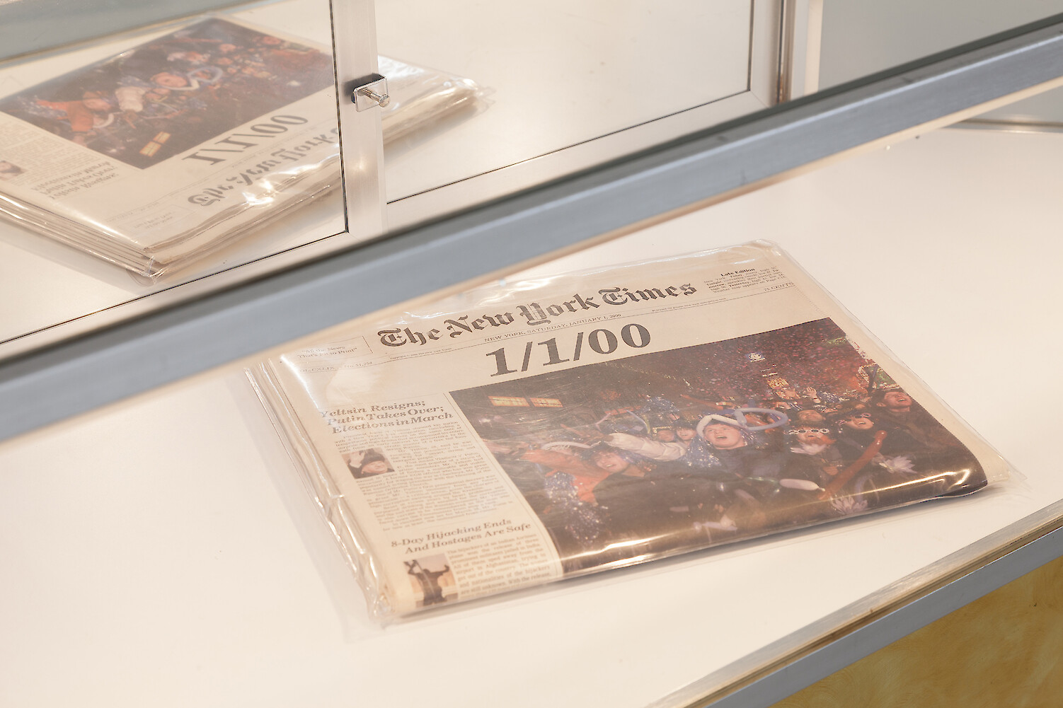 Detail View, *The Portal*, 2018, glass panelled cabinet, New York Times newspaper, 96.5 x 150.5 x 50.5 cm