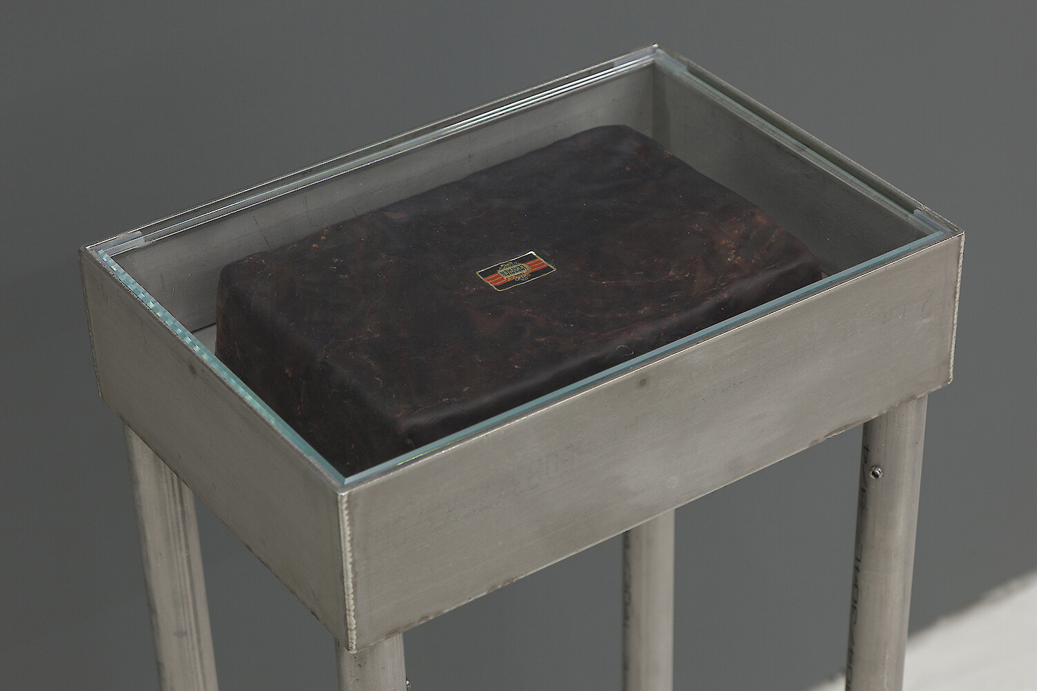 *Third Term* (detail view), 2016, Stainless steel vitrine table, Polymer clay, Newsprint, Card, Marker