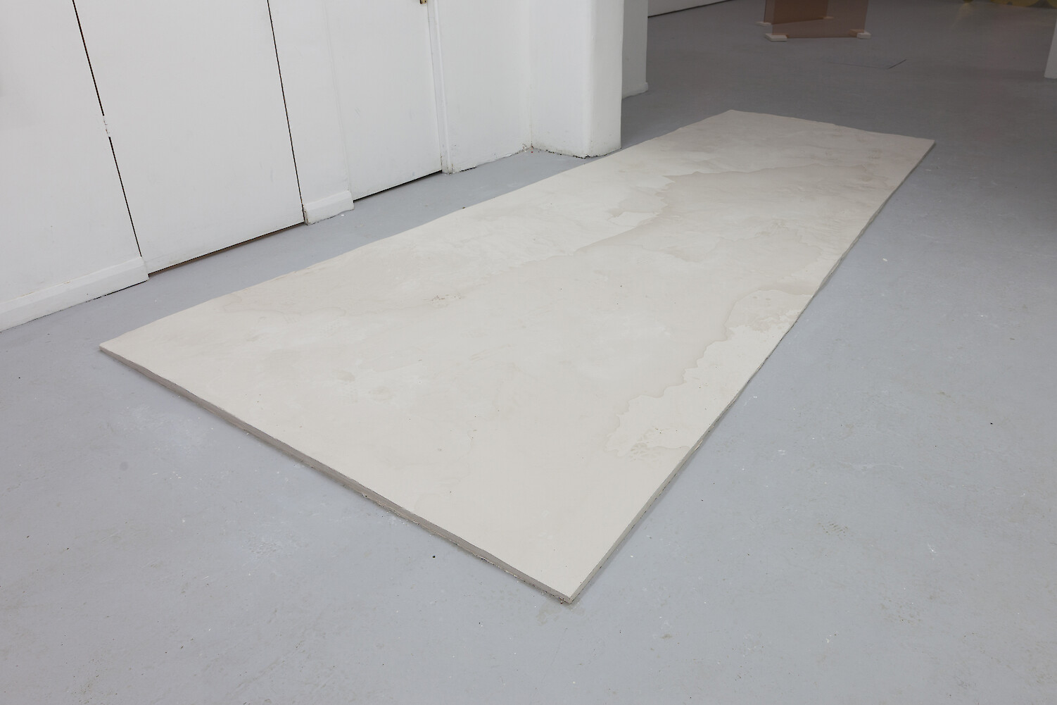 *Untitled*, 2013, Plaster, 2 x 202 x 439 cm