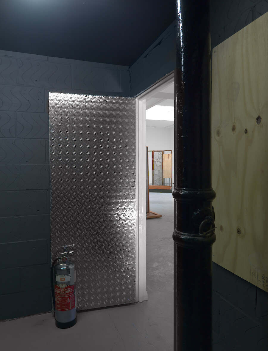 Lloyd Corporation, *Interior Music*, 2011, Beovision 1 television, video (10:53mins), pine boarding, concrete, aluminium treadplate, fire extinguisher, MDF
