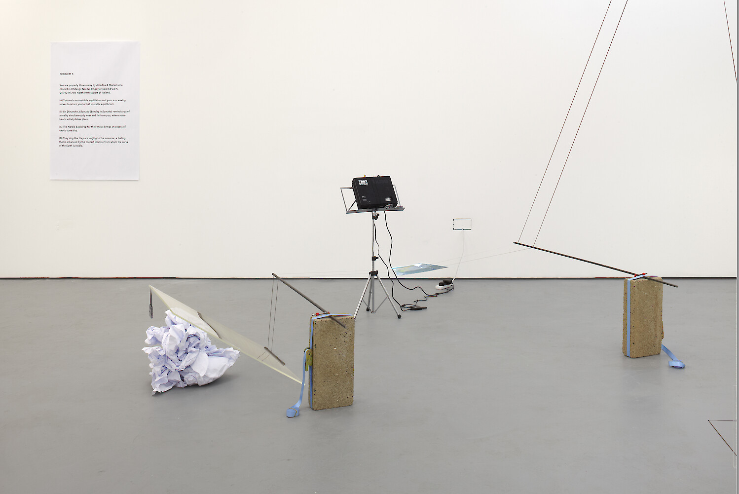 Chooc Ly Tan, *It Depends Mostly On the Slant Of Interplanetary Magnetic Field Lines*, 2012, Mixed media installation with cassette tape, music stand, video projector, water, Plexiglass, two fluorescent lights (detail)