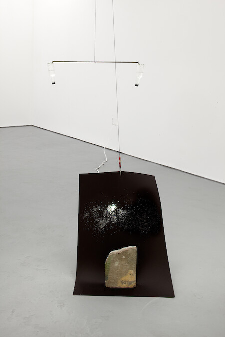 Chooc Ly Tan, *Us, The Stars That Flash in Rhythm... and Everything Else We Aren't Aware Of*, 2012, Inverted bottled water, magnets, steel, paper, concrete, video projector
