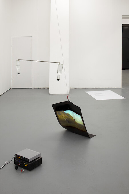 Chooc Ly Tan, *Us, The Stars That Flash in Rhythm... and Everything Else We Aren't Aware Of*, 2012, Inverted bottled water, magnets, steel, paper, concrete, video projector